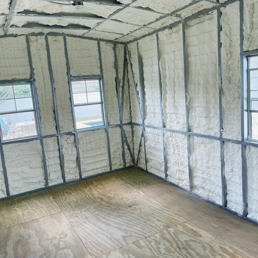 Closed-cell spray foam insulation applied to wall cavities in a residential project in Seffner